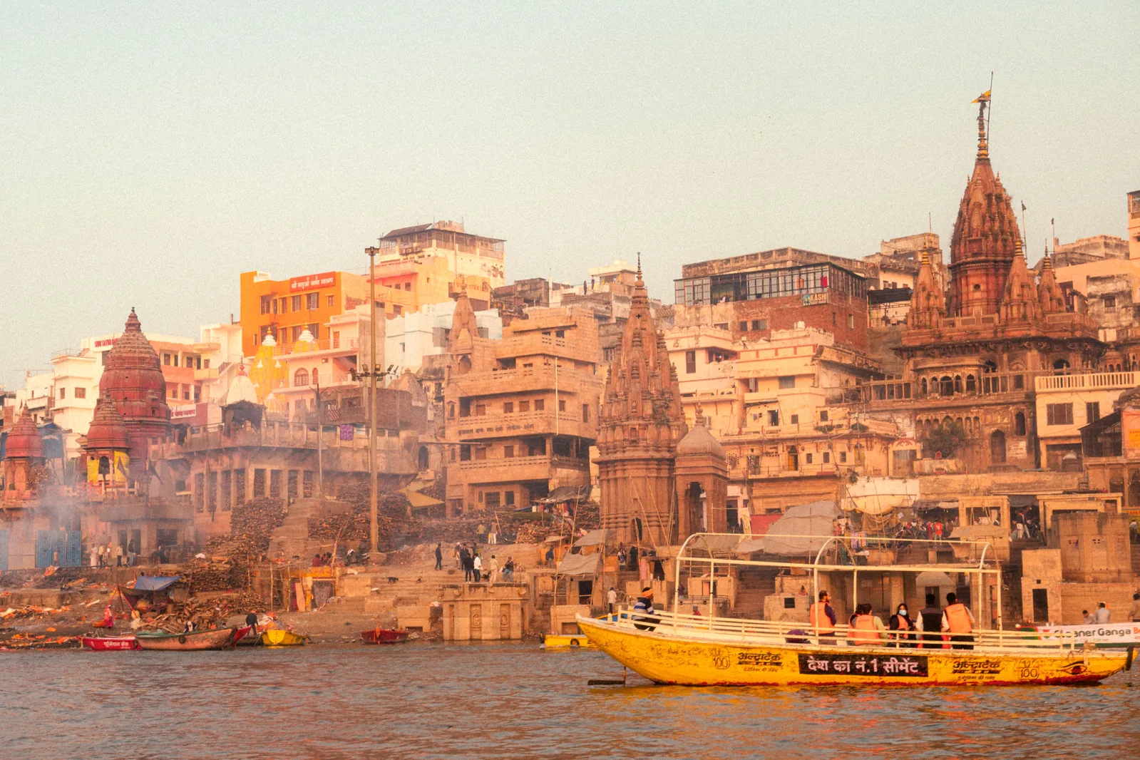 A hotel room balcony overlooking the Ganges river and ghats in Varanasi